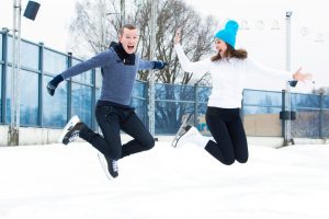 Beautiful, attractive couple on the ice rink